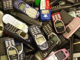 cellphones in pile - made more effective by Geoff London
